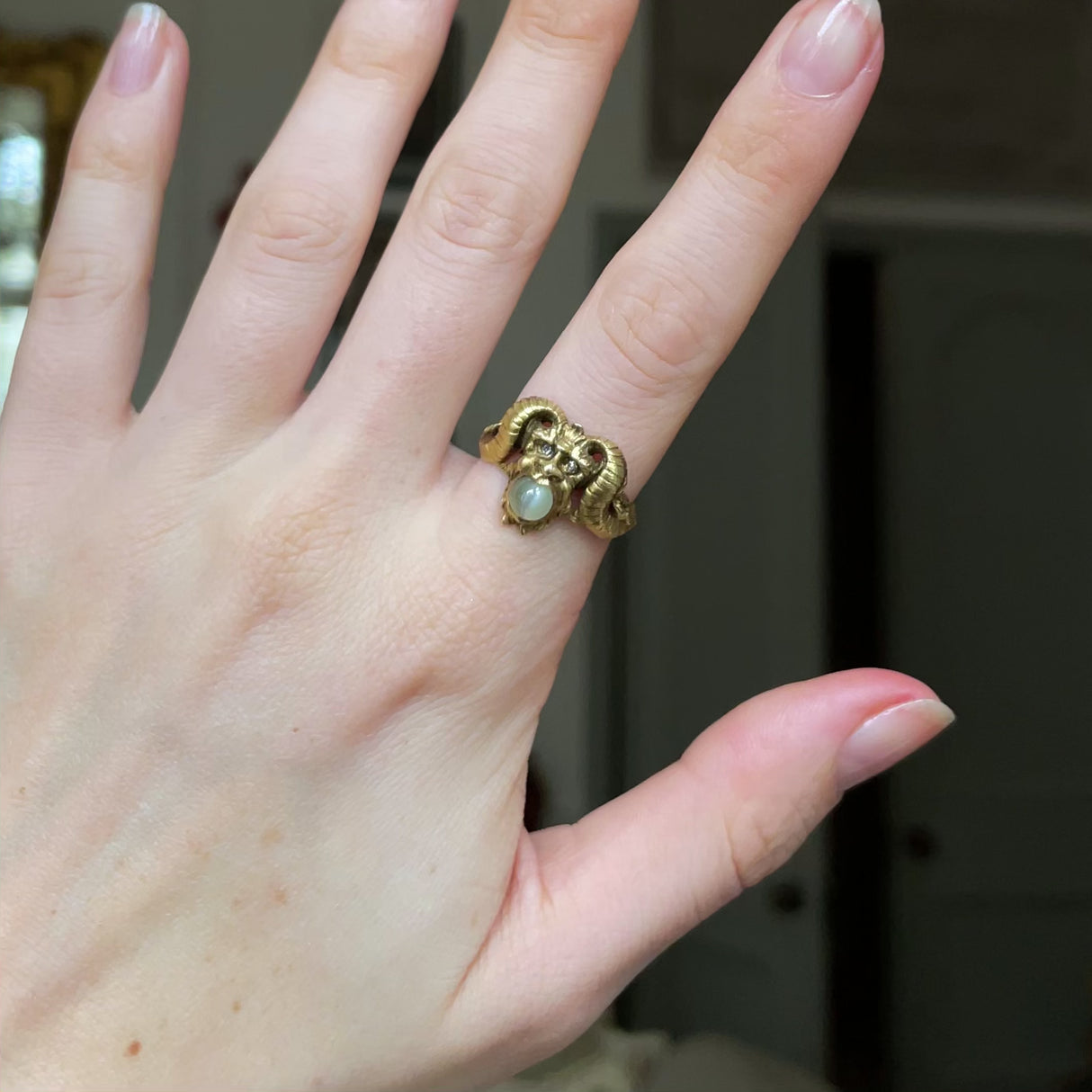 Early 20th century, 18ct gold, cabochon chrysoberyl and diamond 'faun' ring